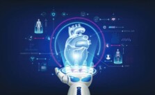 Image of a robotic hand holding a hologram of a human heart and icons related to futuristic medical cybernetics and robotics technology shown around it on a deep blue background.