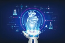 Image of a robotic hand holding a hologram of a human heart and icons related to futuristic medical cybernetics and robotics technology shown around it on a deep blue background.